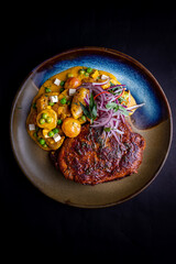 Meal and peruvian patato on a plate