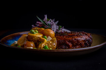 Meal and peruvian patato on a plate