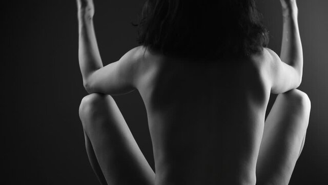 Sexy woman back. Shadow. Erotica. Sexy photo. Beauty. Dark. Passionate concept. Sensuality. 