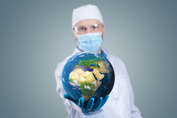 Doctor hold a earth globe in hands and a medical syringe with vaccine against corona virus. 3D...