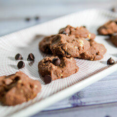 Chocolate crunchy cookies with background decoration. Selective focus.