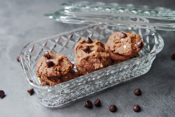 Chocolate crunchy cookies with background decoration. Selective focus.