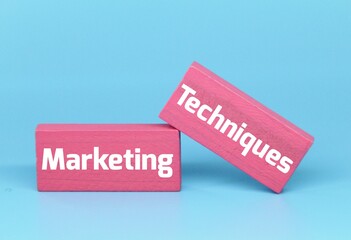 colored blocks with the word marketing techniques. business strategy