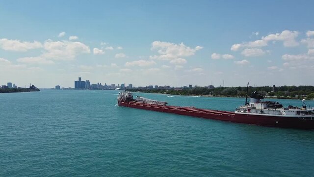 Cargo ship travels the Detroit river on a sunny day
