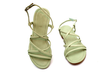Women's summer sandals on a white background, top view - obrazy, fototapety, plakaty