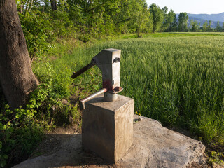 Old Manual water pump in the fields