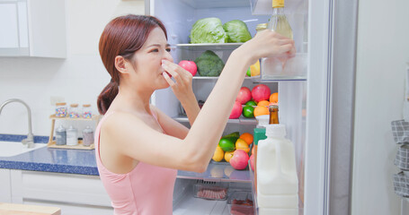 woman open refrigerator