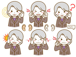 耳に異常があるスーツの高齢女性