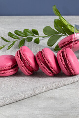 Pink macaroons row on the table.