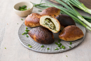 Russian pastries (pirogi) filled with eggs and green onion