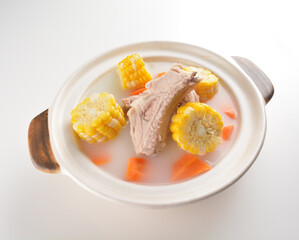 double boiled pork ribs with corn and carrot hot soup in hot clay pot asian Chinese menu
