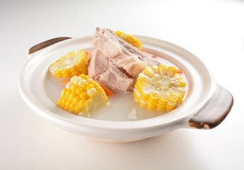 double boiled pork ribs with corn and carrot hot soup in hot clay pot asian Chinese menu