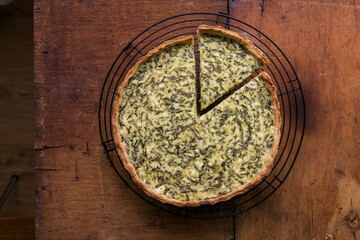 Quiche with spinach - traditional dish of french cuisine. Spinach  tart - obrazy, fototapety, plakaty