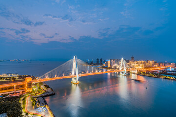 High-view night view of Haidian River Century Bridge in Haikou, Hainan, China 