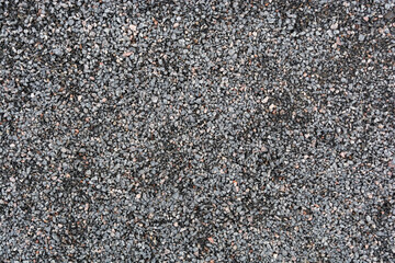 Gravel pebble stone geometric seamless pattern. Background from crushed granite fine gravel close-up