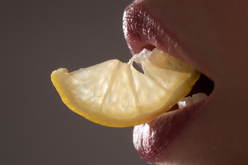 Red lip, set mouth with lemon. Lip care and beauty. Beauty sensual lips. Close up, macro with...