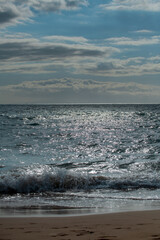 Tropical beach scene. Sea view from summer beach with sky. Coastal landscape. Surf splashing tide.