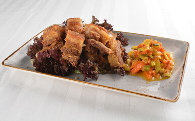 deep fried crispy pork belly crawling with nonya achar salad asian roasted menu