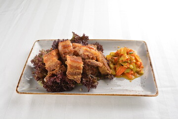deep fried crispy pork belly crawling with nonya achar salad asian roasted menu