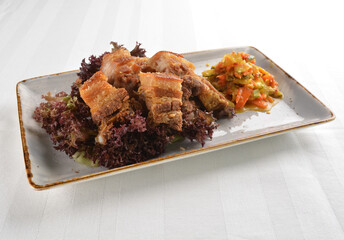 deep fried crispy pork belly crawling with nonya achar salad asian roasted menu