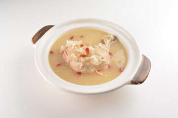 hot double boiled Chinese herbal ginseng chicken soup in claypot asian halal menu