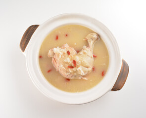 hot double boiled Chinese herbal ginseng chicken soup in claypot asian halal menu