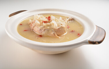 hot double boiled Chinese herbal ginseng chicken soup in claypot asian halal menu