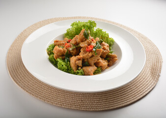 deep fried crispy chicken cube with salted egg yolk paste spicy sauce and curry leaf