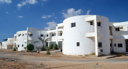 Fototapeta na wymiar Residential non tourist area. White apartment buildings. Sharm El Sheikh, Egypt 