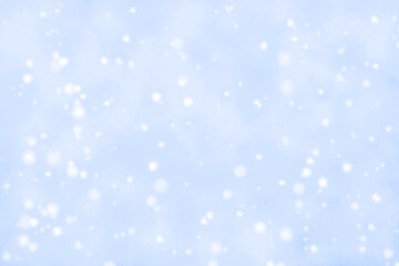 Abstract snowfall background.  Blurred blue and white snowfall background. 