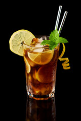 Glass of Fresh Long Island Ice Tea Cocktail - studio shot on black background