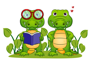 The couple of the smart crocodile is holding the book and standing in the garden
