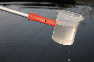 Detail of sampling beaker used for water samples collecting