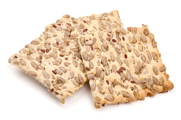 Stack of wholegrain crispy bread with sunflower, linen and sesames seeds, isolated on white background. High resolution image.
