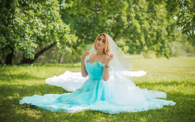 Fototapeta na wymiar Elegant European bride in turquoise dress, fancy bridal collection, dress for wedding