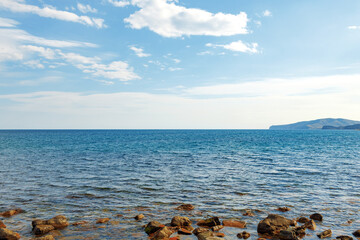 Fototapeta na wymiar Stony sea shore photo for a background