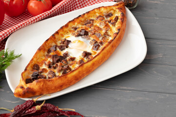 Close up of Turkish Pide bread on wooden table