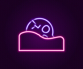 Glowing neon line Human skull in the ground icon isolated on black background. Colorful outline concept. Vector