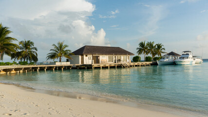 A small house on the pier. A pier for boats.