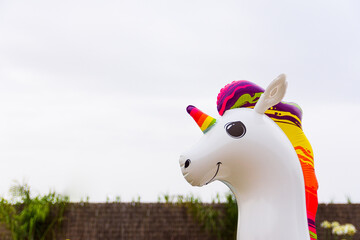 inflatable float in the shape of a colorful unicorn