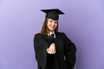 Young university graduate over isolated purple background inviting to come with hand. Happy that you came