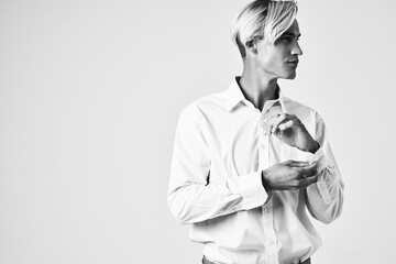 man in a white shirt fashionable hairstyle modern style black and white photo