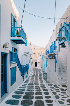 Fototapeta Mykonos Greece, colorful streets of the old town of Mykonos, Traditional narrow street with blue doors and white walls, Mykonos town Greece 