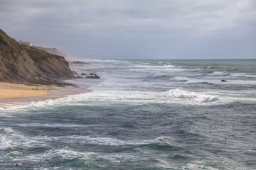 Fototapeta na wymiar View at the angry Atlantic sea, rocks coast and huge cliffs