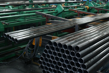 Round carbon steel pipe in cutting process.