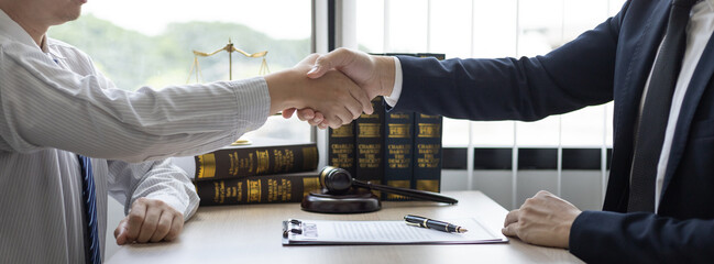 Businessman shaking hands with a lawyer or judge After signing the contract and the agreement is...