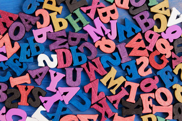 Multicolored letters of the alphabet. The alphabet is in a chaotic state. Letters as a symbol of reading. Reading English literature. Learning to read. Concept - writing and selling books