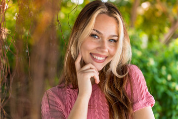 Naklejka premium Pretty blonde woman at ourdoors