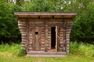 
Small locker room made of wood logs in a publich beach shore in Finland