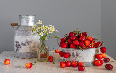 Still life with ripe berries and fragrant wildflowers.